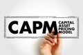 CAPM Capital Asset Pricing Model - relationship between systematic risk and expected return for assets, acronym text concept stamp Royalty Free Stock Photo