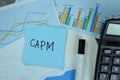 CAPM write on sticky notes isolated on Wooden Table Royalty Free Stock Photo