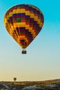 Cappadocia, Anatolia, Turkey: Colorful balloon on the background of the morning blue sky
