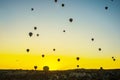 Cappadocia, Goreme, Anatolia, Turkey: Hot air balloon ride sunset silhouettes view. Sunset hot air balloon silhouette. Sunset hot