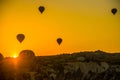 Cappadocia, Goreme, Anatolia, Turkey. Silhouette of hot air balloons fly over Cappadocia