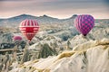 Hilly landscape and balloon. Balloons. Goreme, Cappadocia - Landmark attraction in Turkey Royalty Free Stock Photo