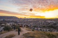10.11.2022 Cappadocia, Turkey. Colourful sunrise with beautiful cloud formation at Cappadocia. Unrecognizable tourists