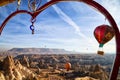 Cappadocia, Turkey - December 20, 2019: Ethnic things and toys and view from top place on the strange landscape in the Cappadocia