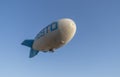 Cappadocia/Turkey-July 07 2019: Airship, zeppelin flying in the blue sky.  Zeppllin airships often offer tourist passengers for Royalty Free Stock Photo