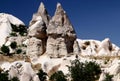 Landscape with snow-white rocks in the shape of mushrooms with caves inside in the Pigeon Valley in Turkey Royalty Free Stock Photo