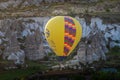 CAPPADOCIA, TURKEY - MAY 04, 2018: Hot air balloon flying over rock landscape at Cappadocia Turkey. Royalty Free Stock Photo