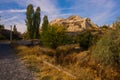 Cappadocia, Turkey: The road that leads to the Rock houses and churches in Goreme national Park. Fairy Chimney in a beautiful Royalty Free Stock Photo