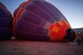 Cappadocia, Turkey - September 14, 2021: Air hot air balloon being filled with helium gas during night by a man, preparation of a