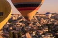 Cappadocia / Turkey - September 14, 2020: Flying hot air balloons and rock landscape at sunrise time in Goreme, Cappadocia, Turkey