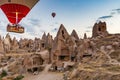 Cappadocia, Turkey - September 1, 2021 - Cappadocia Panoramic - Hot air balloon flying in early morning over rock landscape at Royalty Free Stock Photo