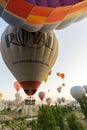 Cappadocia, Turkey - September 14, 2021: Wide angle view of bunch of colorful hot air balloons taking flight or flying int he sky