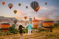 Cappadocia Turkey during sunrise, couple mid age men and woman on vacation in the hills of Goreme Capadocia Turkey, men Royalty Free Stock Photo