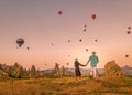 Cappadocia Turkey during sunrise, couple mid age men and woman on vacation in the hills of Goreme Capadocia Turkey, men Royalty Free Stock Photo