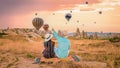 Cappadocia Turkey during sunrise, couple mid age men and woman on vacation in the hills of Capadocia Royalty Free Stock Photo