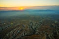 Cappadocia, Turkey: Top view early in the morning from the balloon, misty landscape with fog with mountains