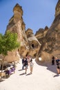 Cappadocia, Turkey. Tourists visiting cells carved into the rocks in the Valley of the Monks (Pashabag)