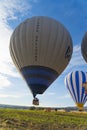 10.11.2022 Cappadocia, Turkey. Vertical shot from ground perspective showing stunning big hot air ballon during take-off