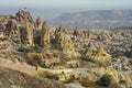 Hilly landscape. Balloons. Goreme, Cappadocia - landmark attraction in Turkey Royalty Free Stock Photo