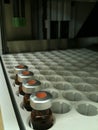 Capped sample vials on an HPLC analysis autosampler