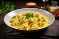 cappelletti in brodo. Traditional italian soup on wooden table