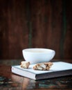 Cappuccino and Cantuccini Italian cookie on dark wooden background.