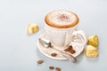 Cappuccino with chocolate candies Royalty Free Stock Photo