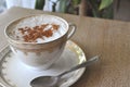 Cappuccino coffee in an antique porcelain cup