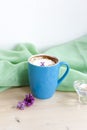 Cappuccino coffee in beautiful blue cups. Spring mood with a Cup of coffee. Royalty Free Stock Photo