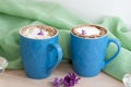 Cappuccino coffee in beautiful blue cups. Spring mood with a Cup of coffee. Royalty Free Stock Photo