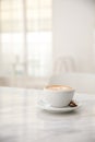 Cappuccino coffee cup on white marble table Royalty Free Stock Photo