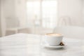 Cappuccino coffee cup on white marble table