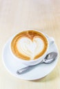 Cappuccino coffee with heart drawing in white cup Royalty Free Stock Photo