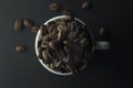 Espresso coffee cup isolate with coffee beans on black background copy space