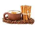 Cappuccino in a cup coffee grains with cinnamon sticks Royalty Free Stock Photo