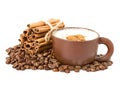 Cappuccino in a cup coffee grains with cinnamon sticks Royalty Free Stock Photo