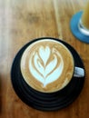 A cappuccino latte art with blurry vision background