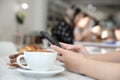 Close up of women hands take a picture coffee in coffee shop