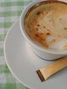 Cappuccino or latte with frothy foam, white coffee cup top view closeup. Cafe and bar, barista concept Royalty Free Stock Photo