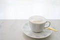 Cappuccino white cup on white table