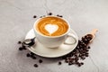 Cappucino coffee with heart shape art in white cup Royalty Free Stock Photo