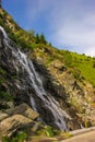 Capra waterfall on the course of the river Capra by the famous road Transfagarasan Royalty Free Stock Photo