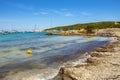 Caprera Island and Spiaggia I Due Mari beach at the Tyrrhenian Sea coastline with Caprera harbor and La Maddalena archipelago in