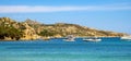 Caprera Island and Spiaggia I Due Mari beach at the Tyrrhenian Sea coastline with Caprera harbor and La Maddalena archipelago in