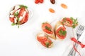 Caprese Bruschetta toast with mozzarella cheese, cherry tomatoes and fresh garden Basil.Traditional Italian food, healthy natural Royalty Free Stock Photo