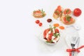 Caprese Bruschetta toast with mozzarella cheese, cherry tomatoes and fresh garden Basil.Traditional Italian food, healthy natural Royalty Free Stock Photo