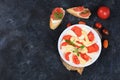Caprese Bruschetta toast with mozzarella cheese, cherry tomatoes and fresh garden Basil.Traditional Italian food, healthy natural Royalty Free Stock Photo