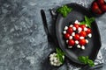 Caprese with cherry tomatoes, mini mozzarella, fresh basil leaves, Traditional italian food, antipasto. banner, menu, recipe place