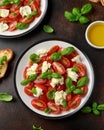 Caprese salad with cherry plum tomatoes, mozzarella cheese and basil. Healthy vegetarian food Royalty Free Stock Photo