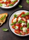 Caprese salad with cherry plum tomatoes, mozzarella cheese and basil. Healthy vegetarian food Royalty Free Stock Photo